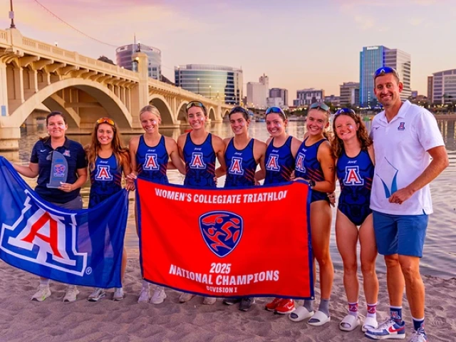 University of Arizona women's triathlon team holding flags