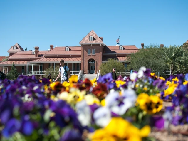 Old Main on the University of Arizona campus in the background of flowers.