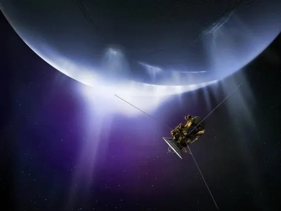 Artist&#039;s impression of the Cassini spacecraft flying through plumes erupting from the surface of Saturn&#039;s moon Enceladus