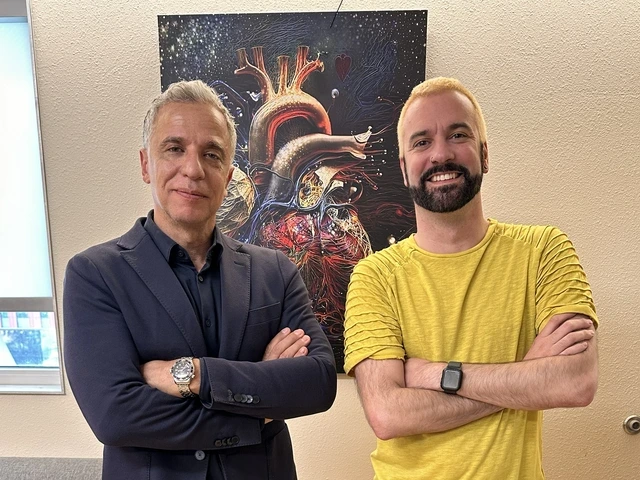 Two men standing next to one another