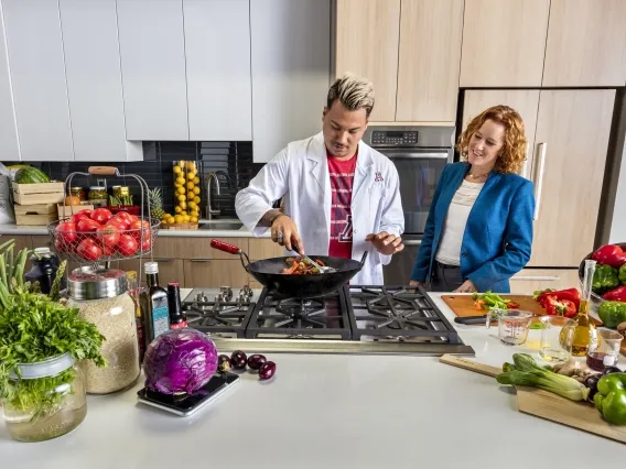 A student cooks whole fresh foods