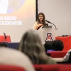 Regina Romero speaking at a podium